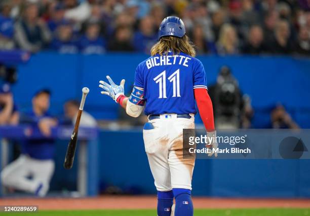 Bo Bichette of the Toronto Blue Jays reacts to striking out to end the seventh inning against the Boston Red Sox during their MLB game at the Rogers...