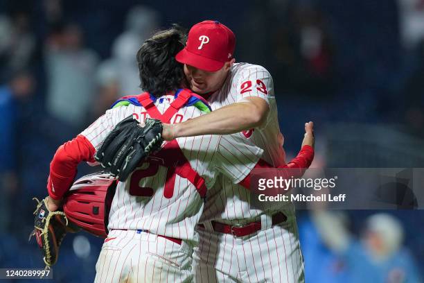 Garrett Stubbs of the Philadelphia Phillies hugs Corey Knebel after the game against the Colorado Rockies at Citizens Bank Park on April 27, 2022 in...