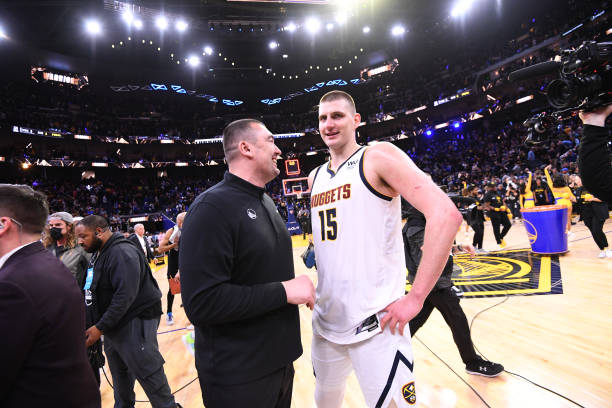 Assistant Coach of the Golden State Warriors, DeJan Milojevic talks with Nikola Jokic of the Denver Nuggets after Round 1 Game 5 of the 2022 NBA...