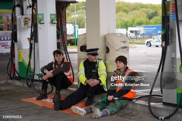 Members of the climate activists group Just Stop Oil blockade a petrol station on the M25 on 28th of April 2022, London, United Kingdom. The activist...