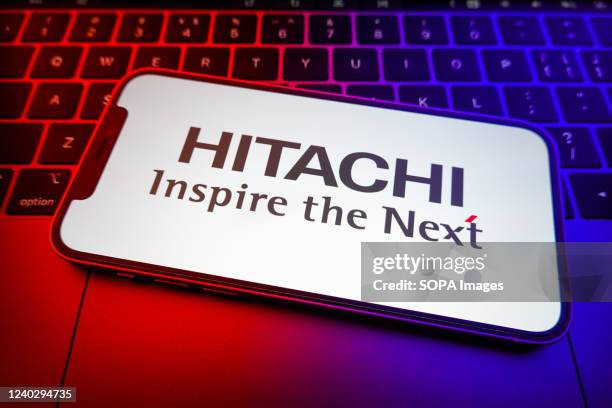 In this photo illustration, a Hitachi logo seen displayed on a smartphone screen.