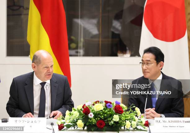 German Chancellor Oraf Scholz delivers a speech before Japanese and German business leaders while Japanese Prime Minister Fumio Kishida looking on...