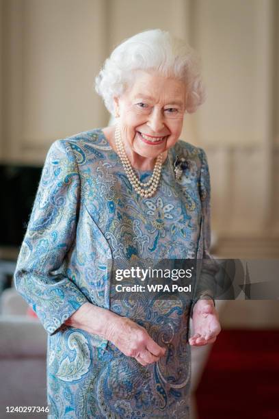 Queen Elizabeth II attends an audience with the President of Switzerland Ignazio Cassis at Windsor Castle on April 28, 2022 in Windsor, England.