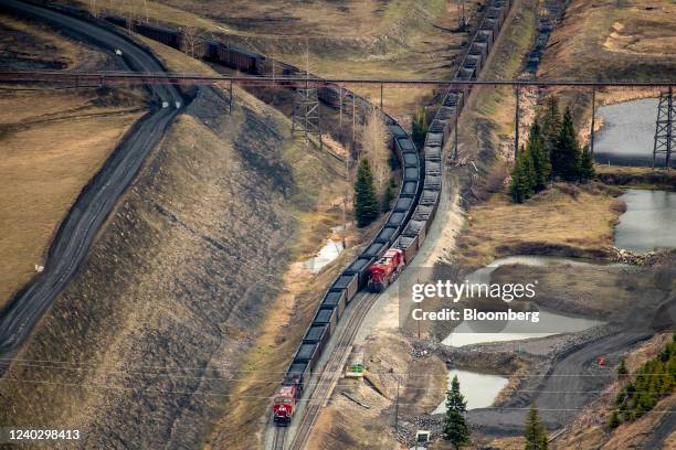 Train cars are loaded with coal at a Teck Resources Elkview Operations steelmaking coal mine in the Elk Valley near Sparwood, British Columbia,...