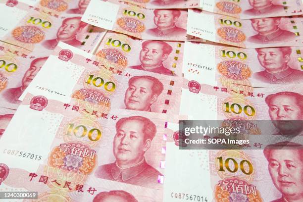 In this photo illustration 100 Chinese Yuan Renminbi banknote seen displayed.