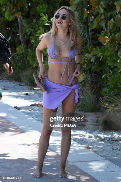 Kimberley Garner is seen on the beach in a purple bikini on April 27, 2022 in Miami, Florida.