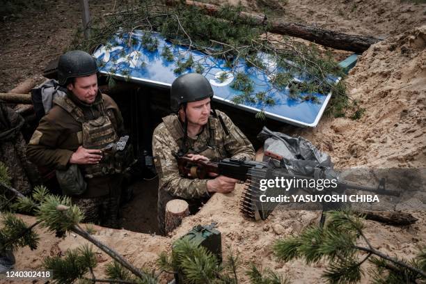 Ukrainian soldiers rest at their position near Lyman, eastern Ukraine, on April 28 amid Russian invasion of Ukraine.