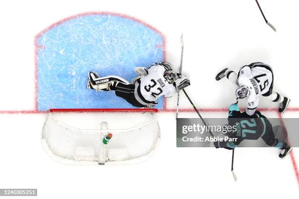 Jonathan Quick of the Los Angeles Kings and Jacob Moverare defend the net against Joonas Donskoi of the Seattle Kraken during the second period at...