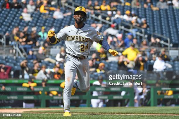 Andrew McCutchen of the Milwaukee Brewers reacts as he runs to first base after hitting a two run RBI single to right field in the ninth inning...