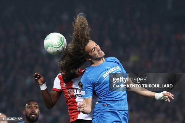 Marseille's French midfielder Matteo Guendouzi fights for the ball with Feyenoord's defender Lutsharel Geertruida during the UEFA Europa Conference...