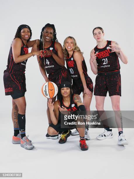 NaLyssa Smith, Queen Egbo, Lexie Hull, Emily Engstler and Destanni Henderson of the Indiana Fever pose for a portrait during Media Day at Gainbridge...