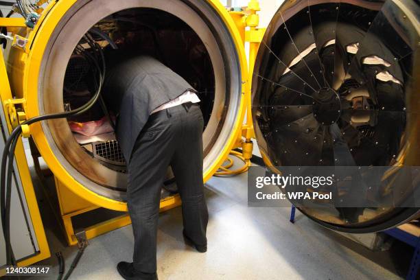 Prime Minister Boris Johnson being shown a pressurised cooker during a campaign visit to Burnley College Sixth Form Centre on April 28, 2022 in...