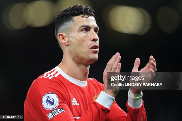 Manchester United's Portuguese striker Cristiano Ronaldo applauds supporters after the English Premier League football match between Manchester...