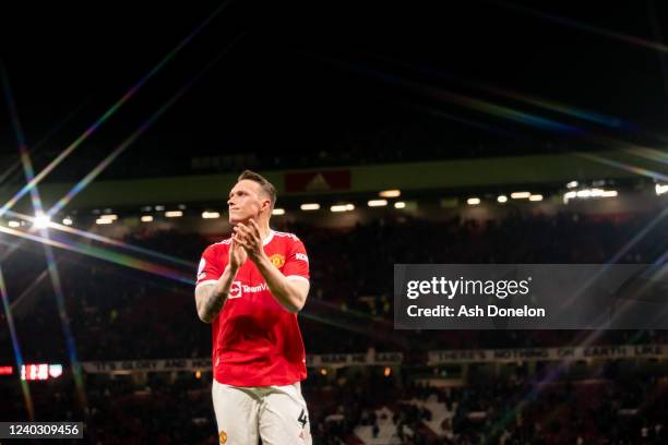 Phil Jones of Manchester United applauds at the end of the Premier League match between Manchester United and Chelsea at Old Trafford on April 28,...