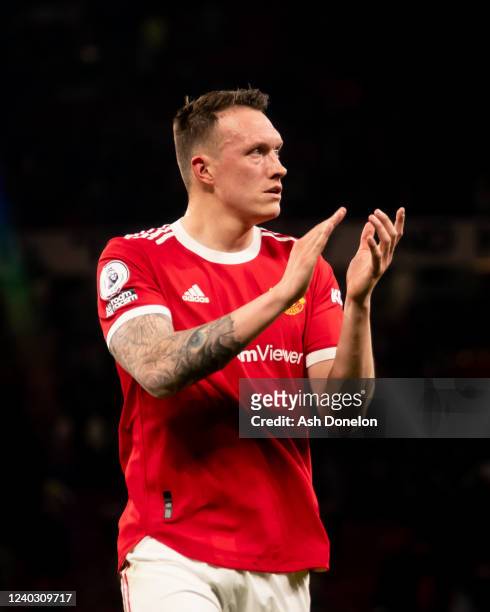 Phil Jones of Manchester United applauds at the end of the Premier League match between Manchester United and Chelsea at Old Trafford on April 28,...