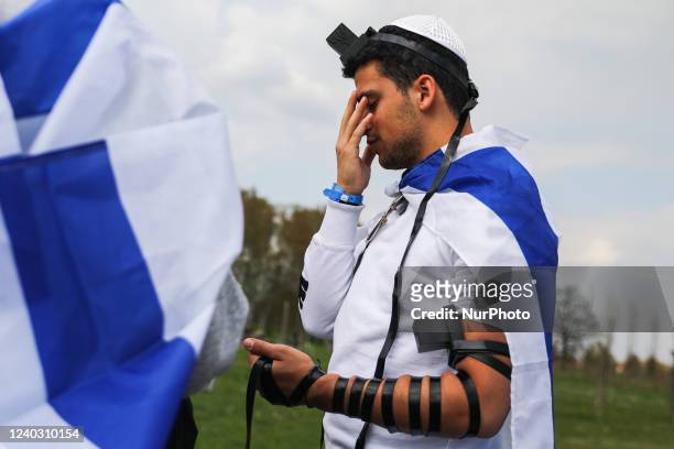 Young Jew prays during the 'March of the Living' at the former Nazi-German Auschwitz Birkenau concentration and extermination camp in Brzezinka,...