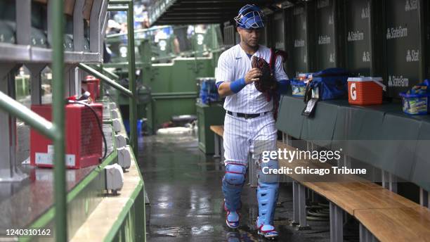 Chicago Cubs catcher Willson Contreras walks in the dugout during a rain delay in a game against the Pittsburgh Pirates on Sunday, April 24 at...