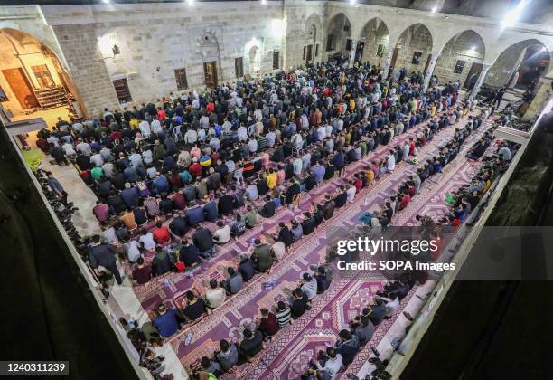 Palestinian Muslims pray Laylat al-Qadr at the Omari Mosque during the holy month of Ramadan in Gaza City. Laylat al-Qadr is one of the last ten...