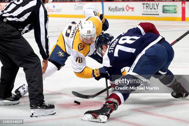 Nico Sturm of the Colorado Avalanche faces off against Colton Sissons of the Nashville Predators at Ball Arena on April 28, 2022 in Denver, Colorado.