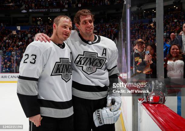 Anze Kopitar of the Los Angeles Kings congratulates teammate Dustin Brown after his last regular season NHL game at Rogers Arena April 28, 2022 in...