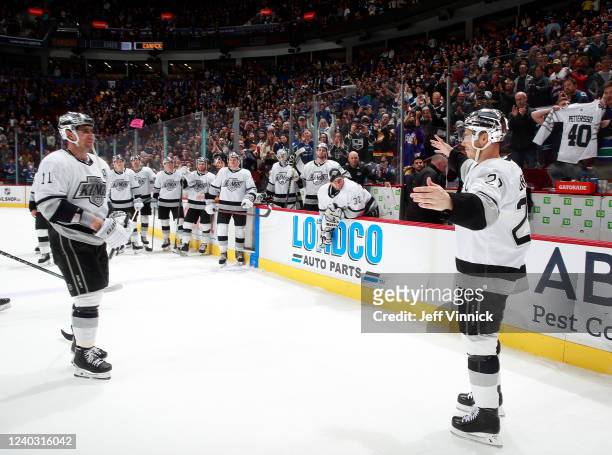Dustin Brown of the Los Angeles Kings is congratulated by teammate Anze Kopitar after his last regular season NHL game at Rogers Arena April 28, 2022...