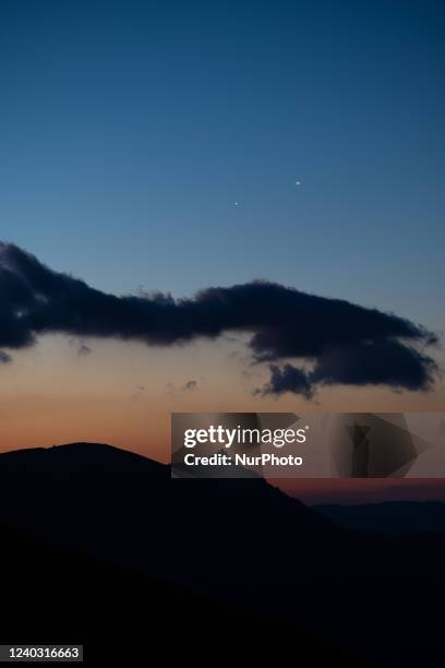 Planets Jupiter and Venus reaching their conjunction rise before sunrise behind Rocca Calascio castle, Italy, on April 29, 2022. On April 30 planets...