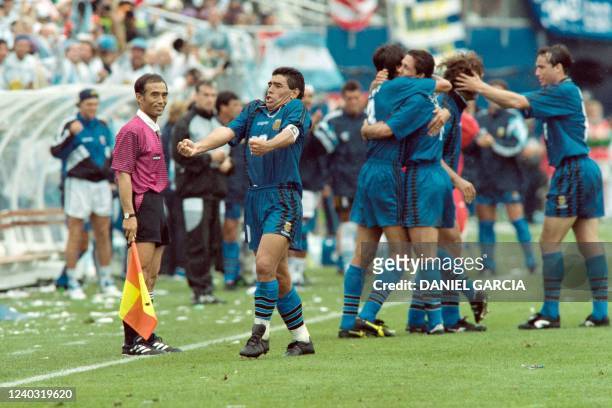 Argentina's Diego Maradona reacts as he and his teammates celebrate after Argentina scored their second goal during the 1994 World cup football match...