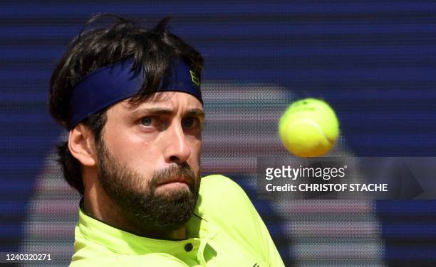 Georgia's Nikoloz Basilashvili returns the ball to Serbia's Miomir Kecmanovic during their quarterfinal match of the ATP tennis BMW Open in Munich,...