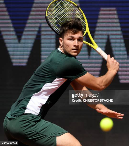 Serbia's Miomir Kecmanovic returns the ball to Georgia's Nikoloz Basilashvili during their quarterfinal match of the ATP tennis BMW Open in Munich,...