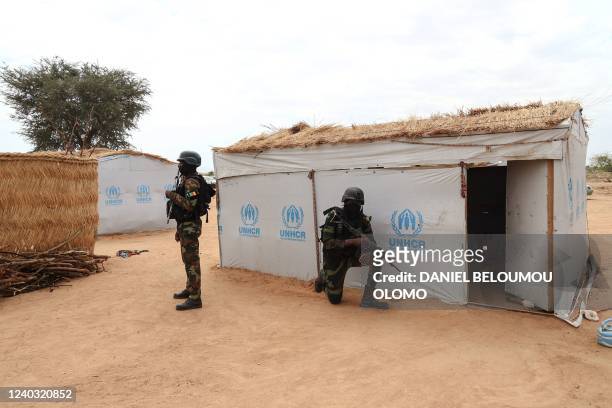 Security elements take a position near a shelter at the Bogo IDP site, during the visit of Filippo Grandi, UNHCR High Commissioner during a field...