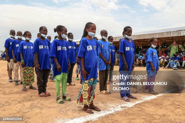 Group of children look on during a field visit by Filippo Grandi, the United Nations High Commissioner for Refugees , in Maroua on April 28, 2022. -...