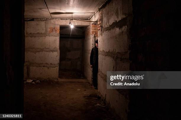 Civilians are seen sheltering beneath their apartment building in Kharkiv, Ukraine on April 29, 2022