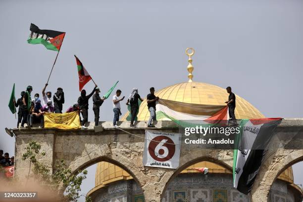 Palestinians gather in the courtyard of the Al-Aqsa Mosque after the Friday prayer during a protest against the Israeli forces' violations on Al-Aqsa...