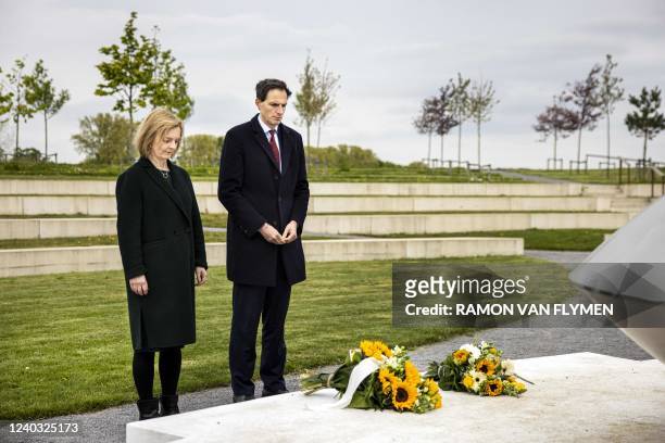 Netherlands' Foreign Affairs Minister Wopke Hoekstra and his British counterpart Liz Truss pay tribute in front of the MH17 monument in Vijfhuizen on...