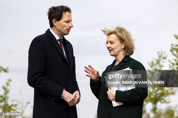 Netherlands' Foreign Affairs Minister Wopke Hoekstra listens to his British counterpart Liz Truss during a visit at the MH17 monument in Vijfhuizen...