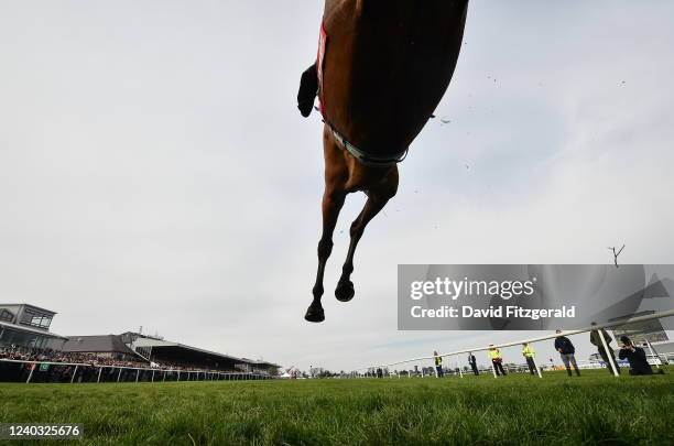 Kildare , Ireland - 29 April 2022; Scarlet And Dove, with Bryan Cooper up, jumps the last on their way to winning the Hanlon Concrete Irish EBF...