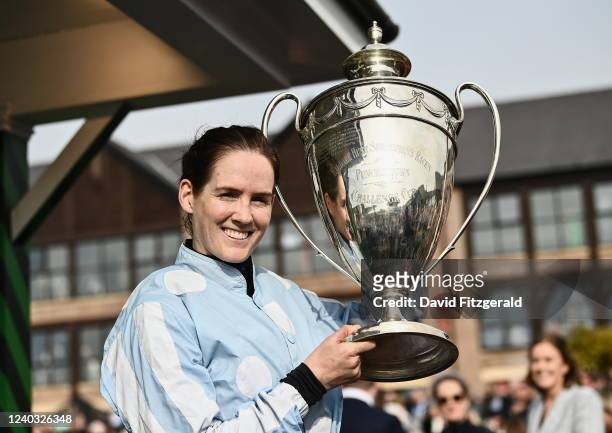 Kildare , Ireland - 27 April 2022; Jockey Rachael Blackmore celebrates with the cup after riding Honeysuckle to victory in the Ladbrokes Punchestown...