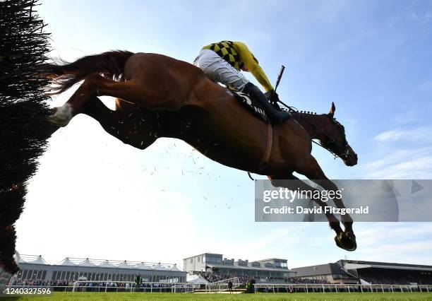 Kildare , Ireland - 29 April 2022; State Man, with Paul Townend up, jumps the last on their way to winning the Irish Daily Star Champion Hunters...