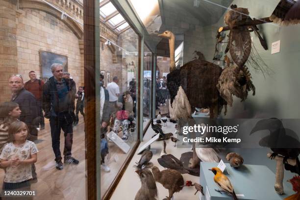 Visitors in the birds exhibition room at the Natural History Museum on 27th April 2022 in London, United Kingdom. The museum exhibits a vast range of...