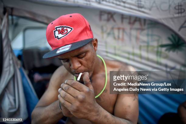Los Angeles, CA LaVion Phillips, 24-years-old, smokes Spice, synthetic marijuana, on San Pedro Street in the Skid Row area of Los Angeles, Tuesday,...
