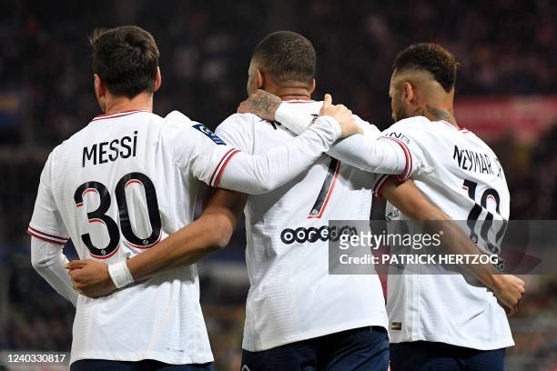 Paris Saint-Germain's French forward Kylian Mbappe celebrates with Paris Saint-Germain's Argentinian forward Lionel Messi and Paris Saint-Germain's...