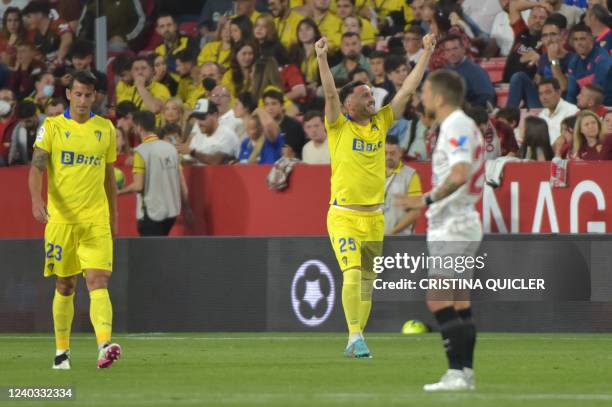 Cadiz's Spanish forward Lucas Perez celebrates after scoring his team's first goal during the Spanish League football match between Sevilla FC and...