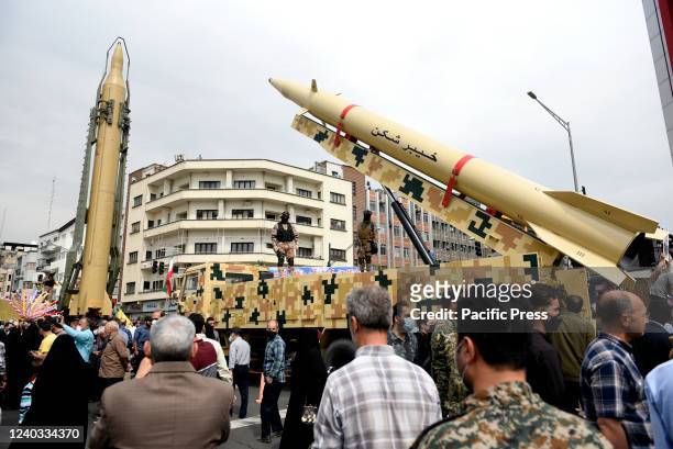 Shahab-3", left, and "Khaibar-buster" missiles displayed during the annual pro-Palestinians Al-Quds or Jerusalem Day rally in Tehran....