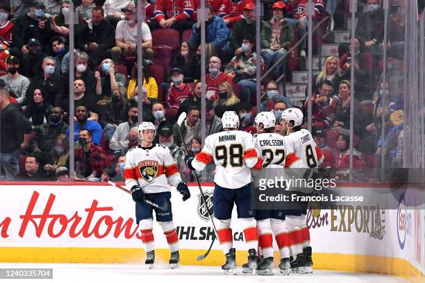 Ben Chiarot of the Florida Panthers celebrates with teammates after scoring a goal against the Montreal Canadiens in the NHL game at the Bell Centre...