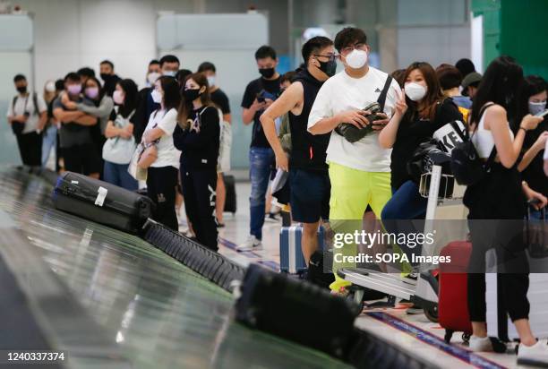 Tourists wait for their bags as they arrive at Suvarnabhumi international airport. The Thai government has announced that from May 1 the Test & Go...