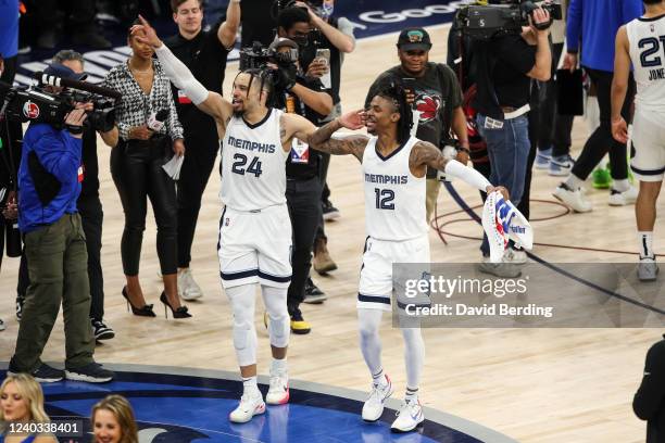 Dillon Brooks and Ja Morant of the Memphis Grizzlies celebrate a 114-106 victory against the Minnesota Timberwolves to advance to the Western...