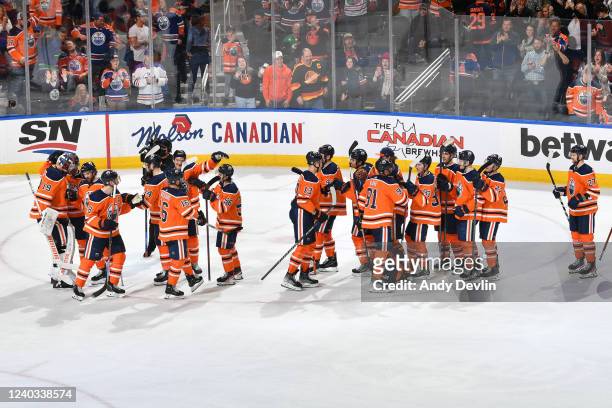 Players of the Edmonton Oilers celebrate after winning the game against the Vancouver Canucks on April 2, 2022 at Rogers Place in Edmonton, Alberta,...