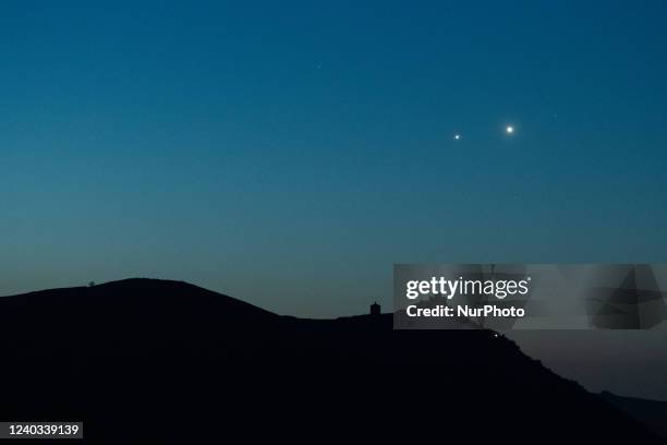 Planets Jupiter and Venus in conjunction rise before sunrise behind Rocca Calascio castle, Italy, on April 30, 2022. On May 1st planets will reach a...