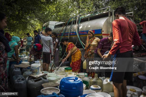 Residents fill water from a Delhi Municipal Corp. Truck in New Delhi, India, on Saturday, April 30, 2022. India is experiencing a heat wave, with the...