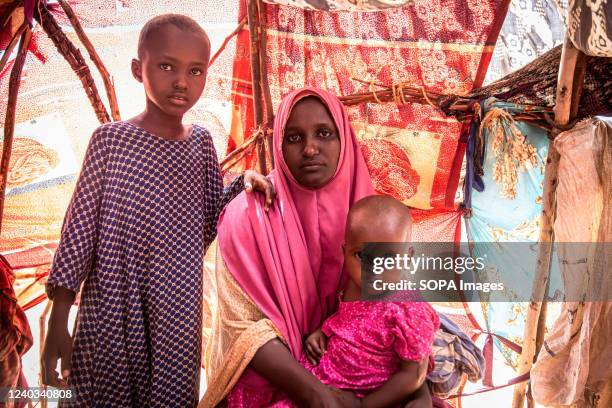 Katra Aden Abdi said she left an area controlled by Al Shabaab with her two children, because the militant group would not allow external aid to...